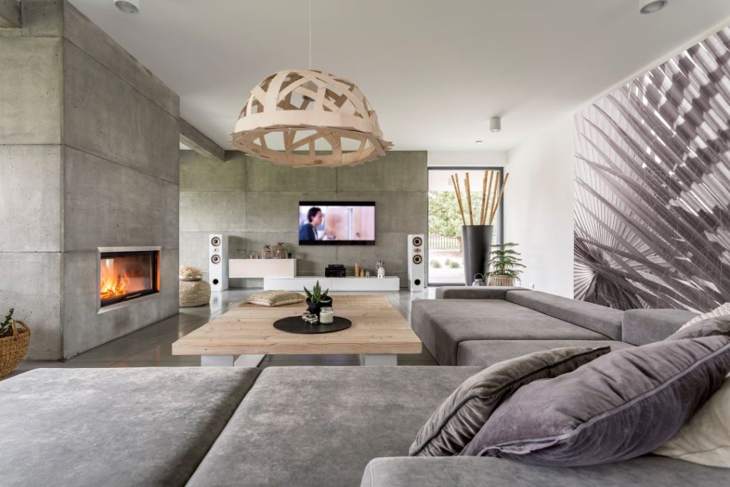 A cozy living room with a modern gas fireplace and comfortable seating