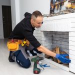 Professional technician inspecting a fireplace for maintenance
